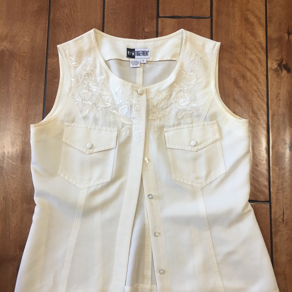 Women’s sleeveless cream color blouse